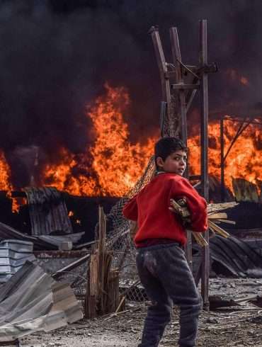 Alt: Syrian family in wartime - 5th Place Photo Series by Mouneb Taim, Syria.